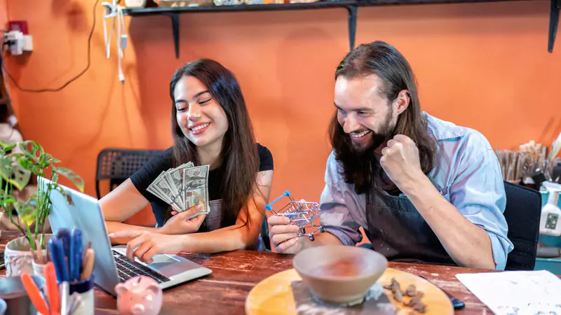happy-couple-earning-extra-income-online-celebrating-side-hustle-success