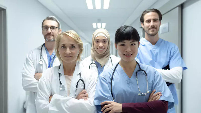 diverse-healthcare-team-in-hospital-corridor-showing-survey-opportunities-for-nurses-and-other-professionals