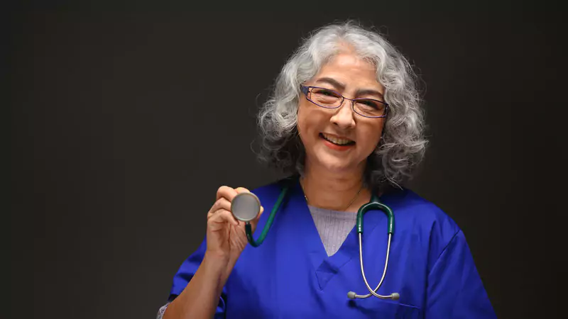 smiling-retired-nurse-holding-stethoscope-symbolizing-early-retirement-success