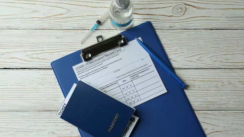 covid-vaccination-record-passport-and-clipboard-symbolizing-nurse-survey-participation