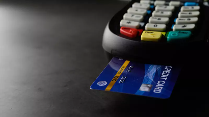 credit-card-inserting-into-pos-terminal-to-represent-survey-payments