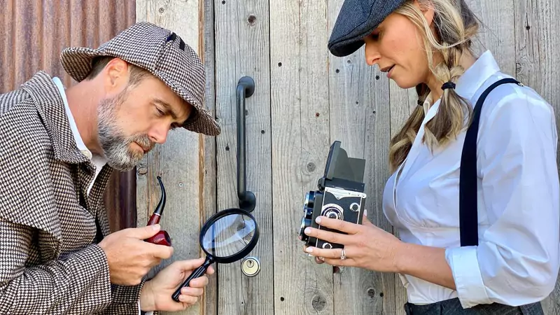 two-detectives-dressed-in-costume-investigating-a-clue-symbolizing-nurses-tracking-missing-medical-supplies