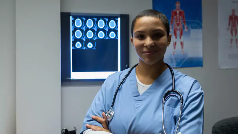 confident-nurse-practitioner-in-front-of-scan-results