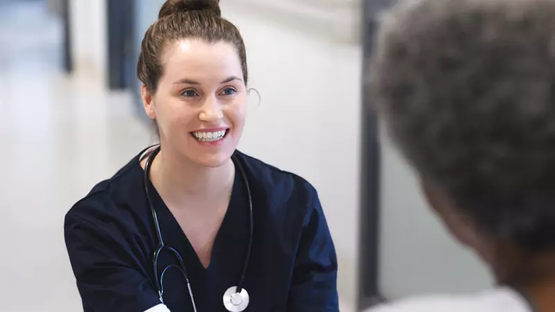 clinical-nurse-specialist-smiling-during-consultation