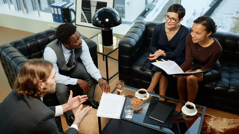diverse-legal-team-discussing-case-with-documents-in-modern-office