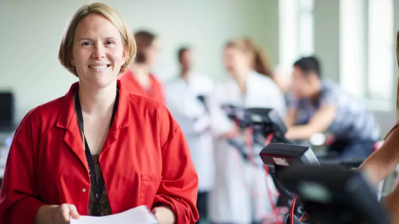 nurse-researcher-holding-documents-in-medical-lab