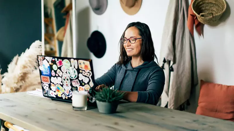 nurse-working-from-home-on-laptop-participating-in-paid-medical-surveys