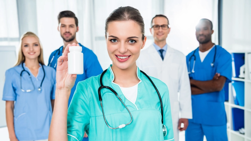 Confident aesthetic nurse holding a product bottle with a supportive medical team in the background, representing professional branding and credibility